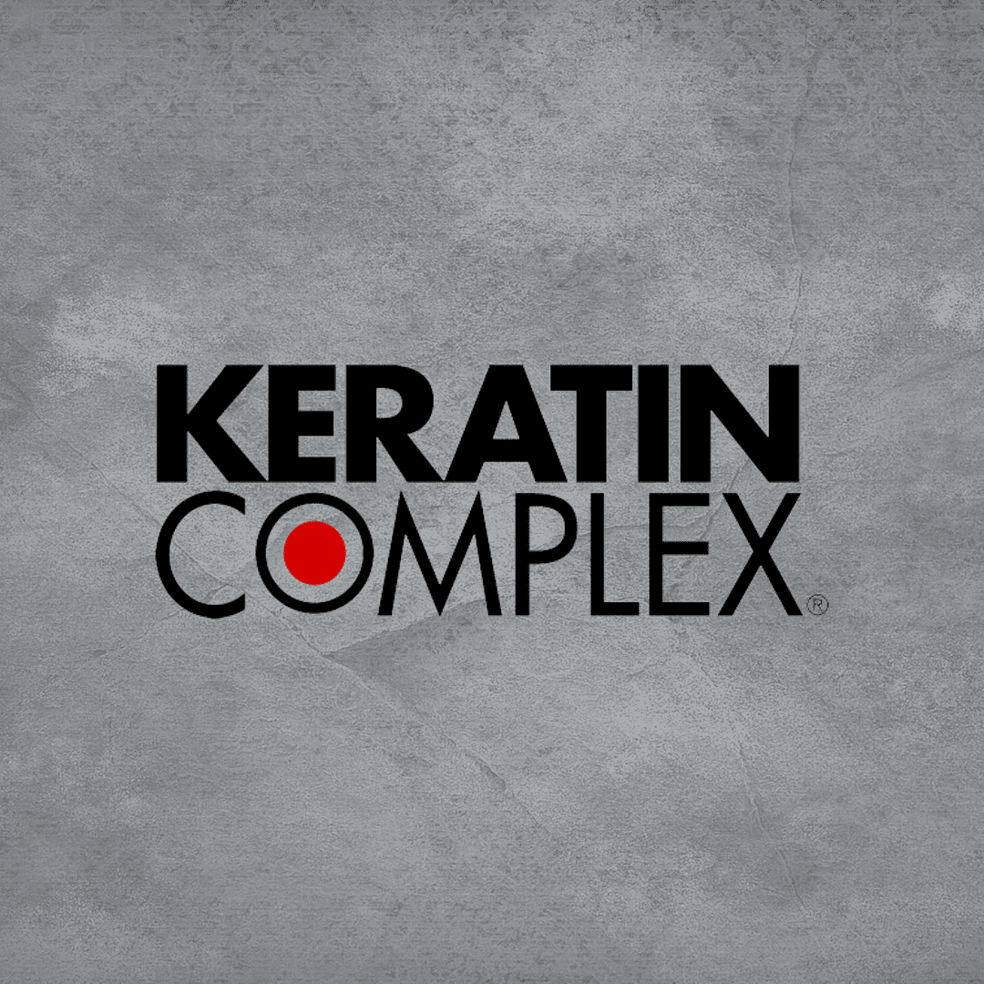 Logo of Keratin Complex on a textured grey background.